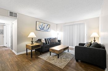a living room with a couch and a table at Diamond  Trail Apartments, Oklahoma City, 73112
